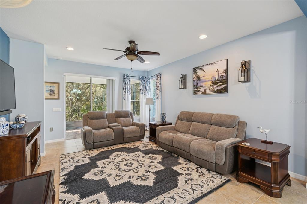 1689 Trabuco Canyon Court Kissimmee, FL 34759 - Photo 5 of 52 a living room with furniture ceiling fan and a rug