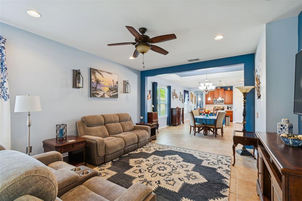 1689 Trabuco Canyon Court Kissimmee, FL 34759 - Photo 8 of 52 a living room with furniture and a large window