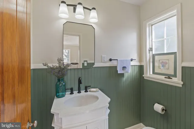 a kitchen with stainless steel appliances kitchen island granite countertop a stove and a sink