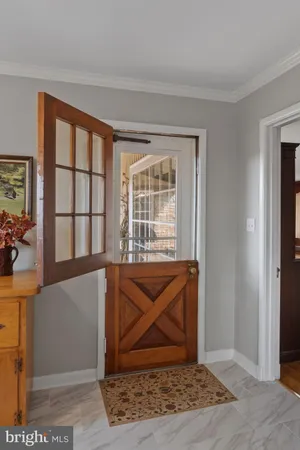 a bathroom with a granite countertop shower a mirror and a sink