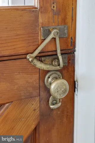 a bathroom with a granite countertop sink a mirror and shower