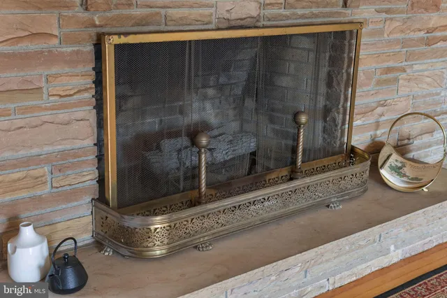 a view of a dining room with furniture and a potted plant