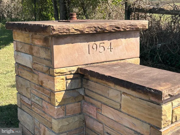 a view of a swimming pool with outdoor seating