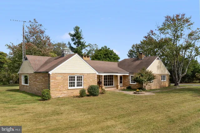 a view of swimming pool with outdoor seating