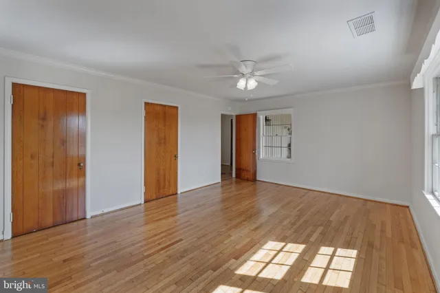 a view of a house with a yard covered in snow