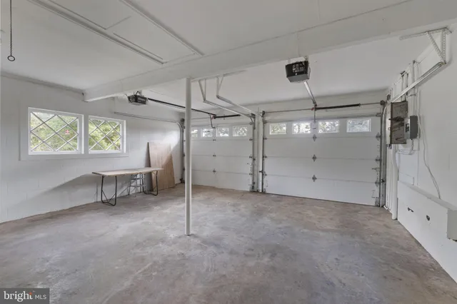 a view of a brick house with a yard