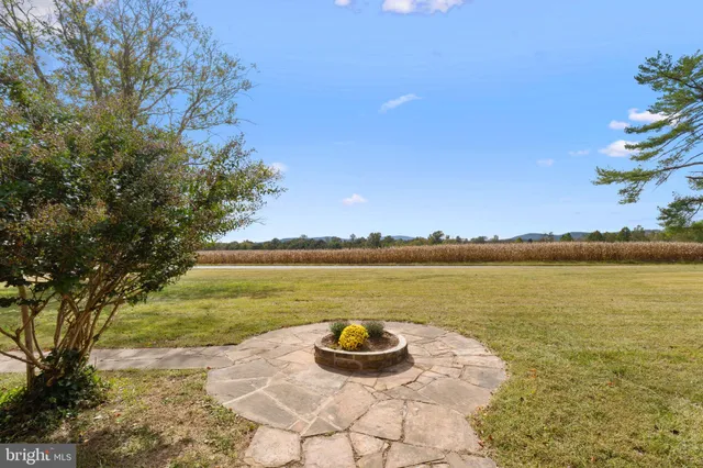 a view of a swimming pool with an outdoor space and seating area