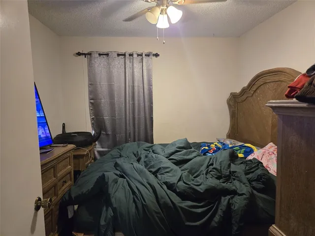 a bedroom with a bed and a closet