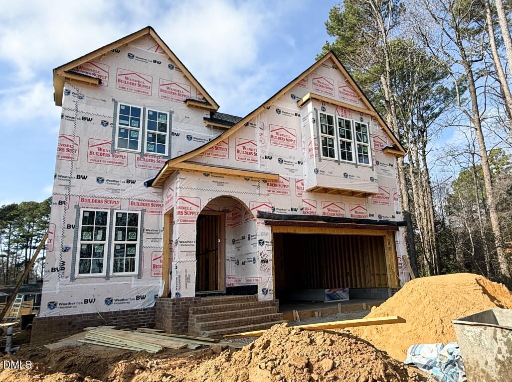 6513 Burnette Flower Way Raleigh, NC 27612 - Photo 1 of 22 a front view of a house with a yard