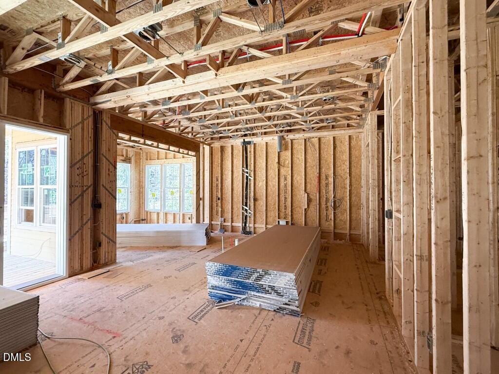 6513 Burnette Flower Way Raleigh, NC 27612 - Photo 7 of 22 a spacious bedroom with a bed and a window