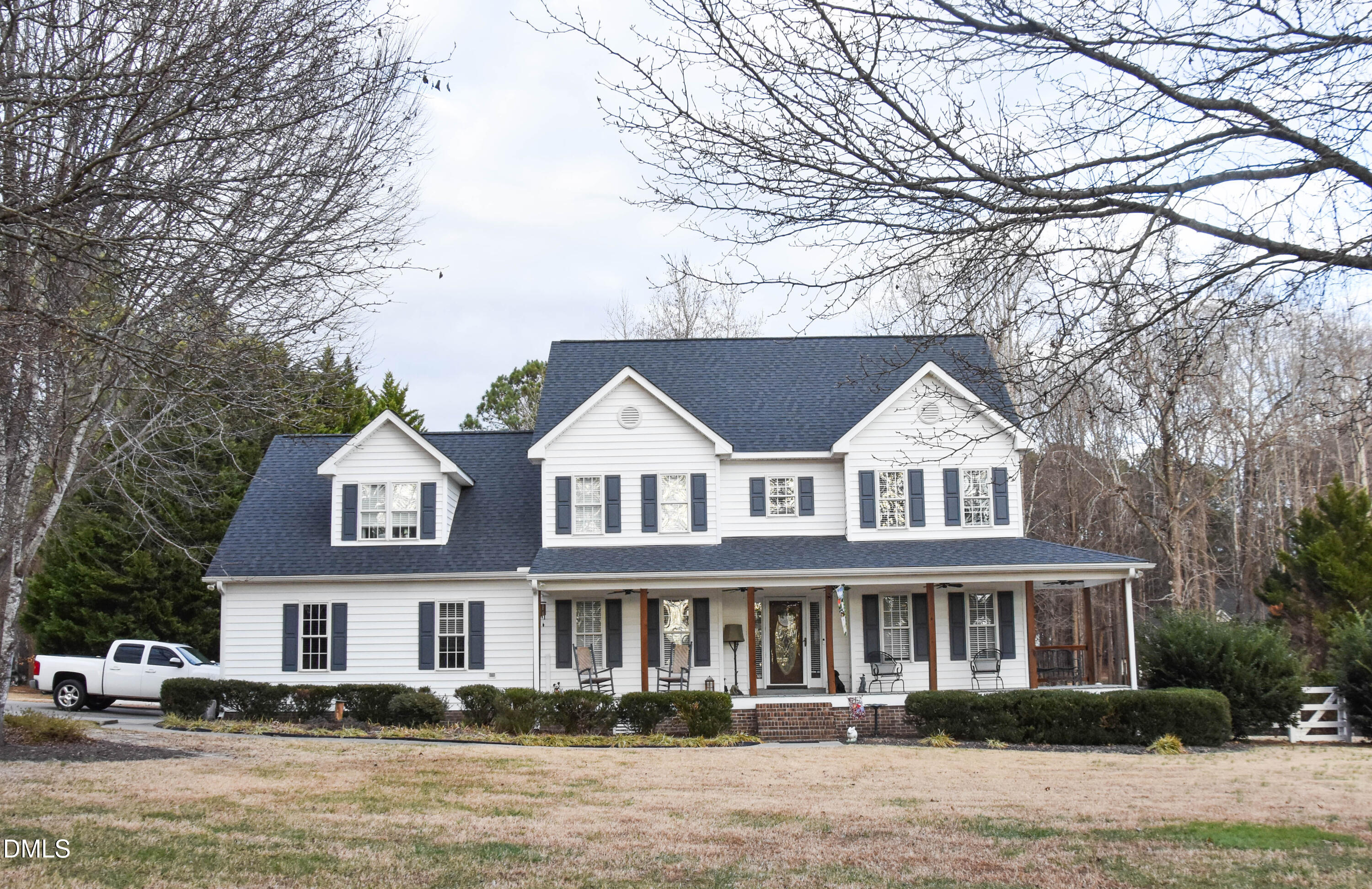 5908 Deep Spring Circle Wake Forest, NC 27587 - Photo 2 of 51 a front view of a house with a garden and lake view