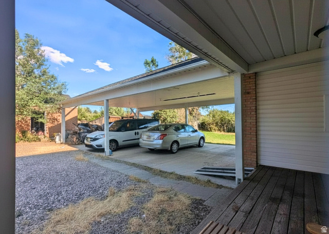 190 North 200 E Street Beaver, UT 84713 - Photo 9 of 40 Expansive two-car carport with a concrete slab and direct access to a side entrance