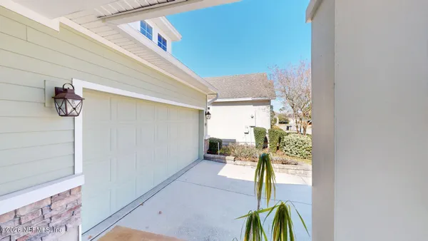 a view of a hallway with a wooden door