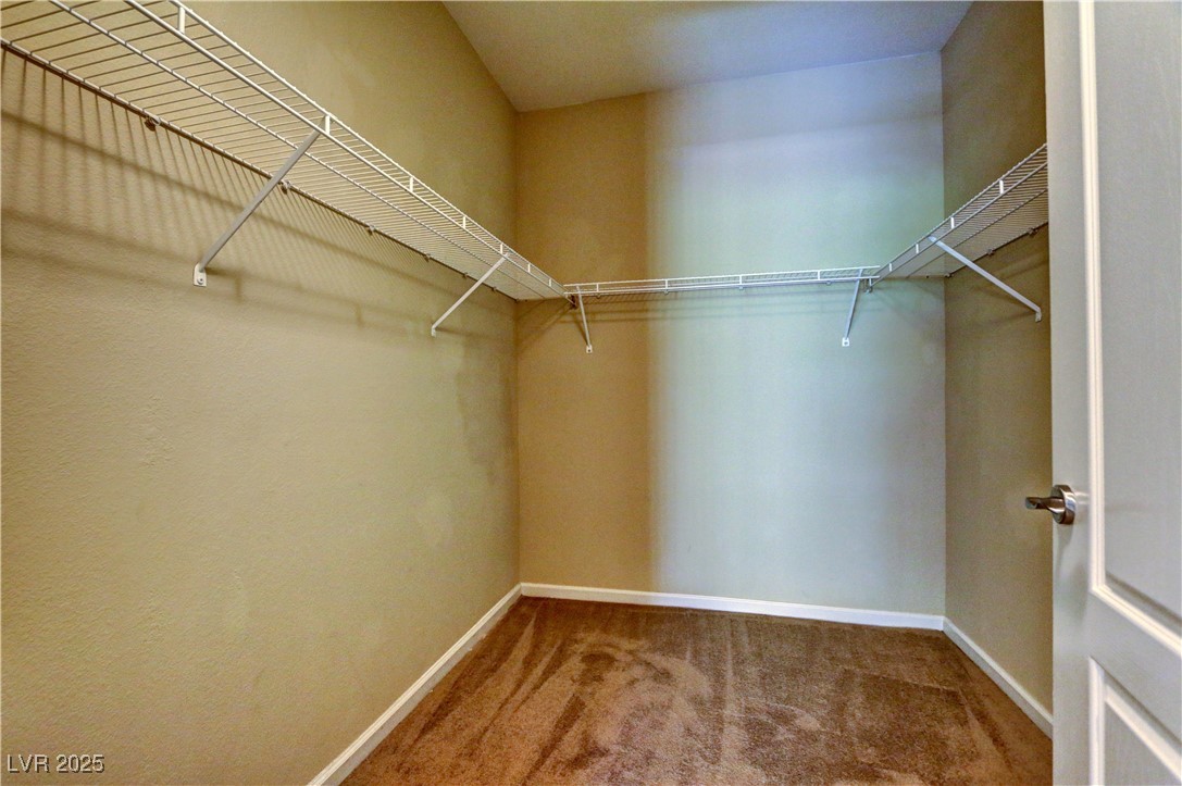 10225 King Henry Avenue, Unit 104 Las Vegas, NV 89144 - Photo 14 of 24 Spacious closet with light colored carpet