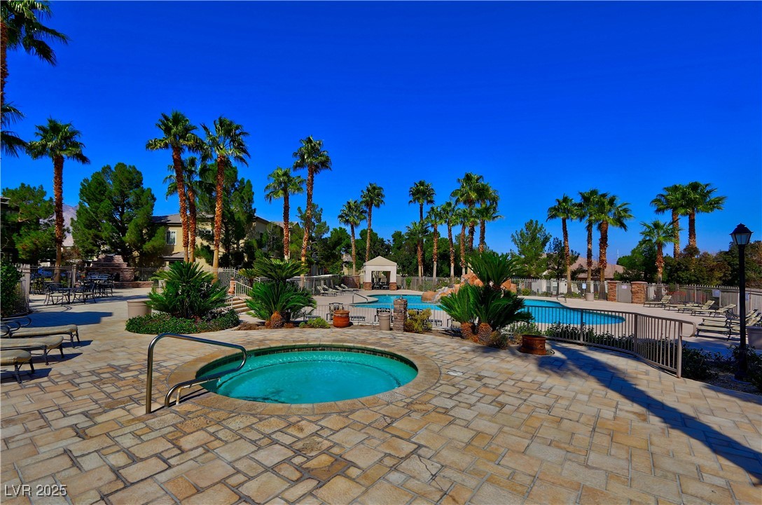 10225 King Henry Avenue, Unit 104 Las Vegas, NV 89144 - Photo 21 of 24 Community pool featuring a patio and a hot tub