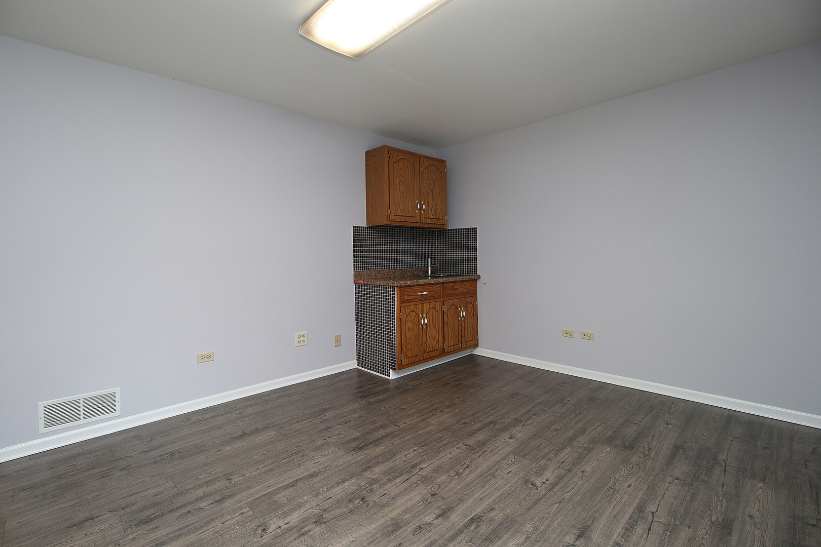 24218 West Main Street Plainfield, IL 60544 - Photo 13 of 19 a view of an empty room with wooden floor and wooden floor