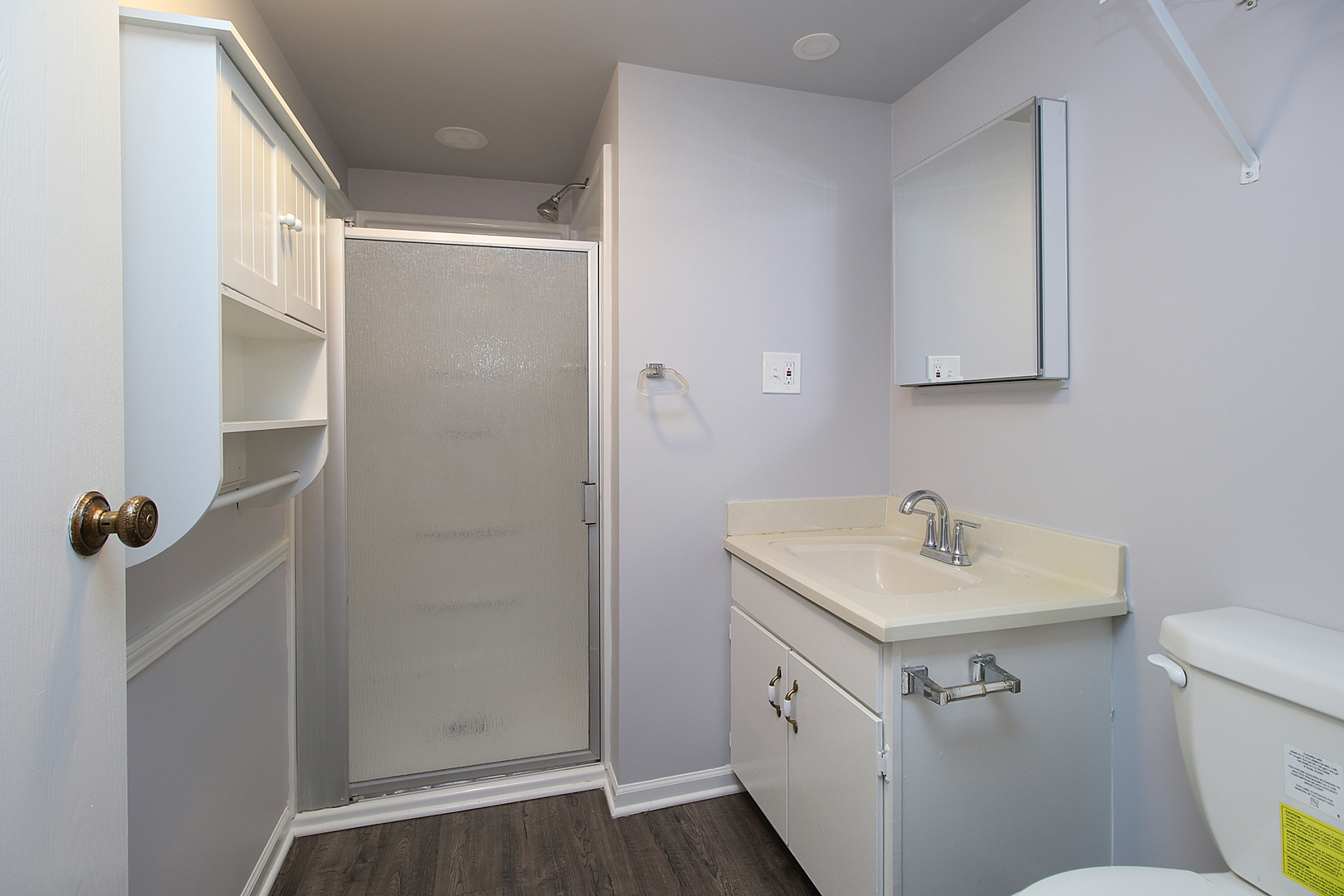 24218 West Main Street Plainfield, IL 60544 - Photo 15 of 19 a bathroom with a sink a toilet a shower and vanity