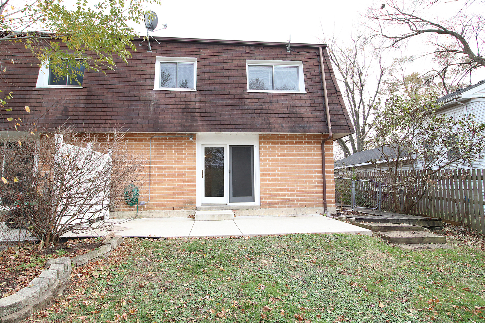 24218 West Main Street Plainfield, IL 60544 - Photo 16 of 19 a front view of a house with a yard