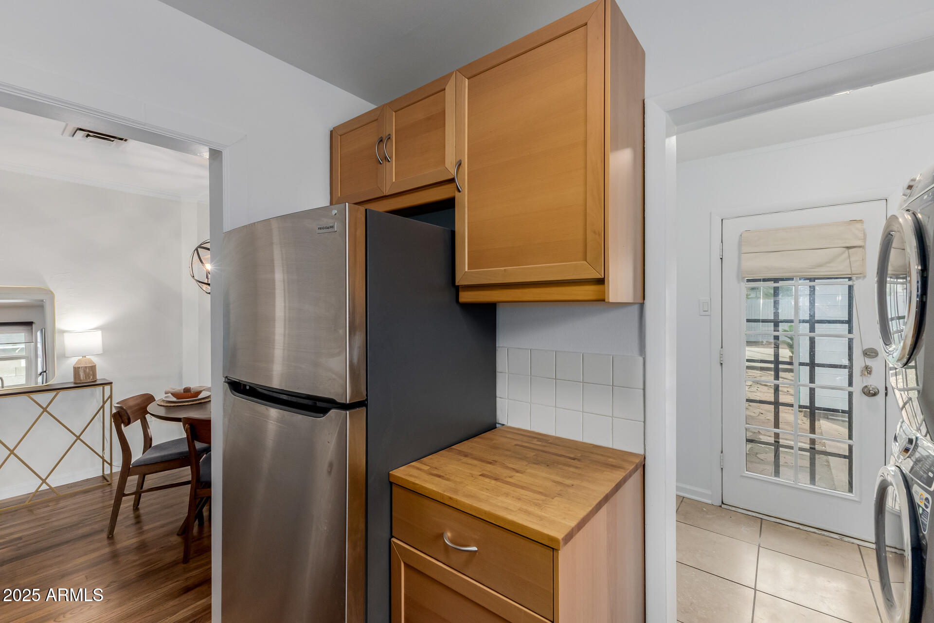 1305 East Granada Road Phoenix, AZ 85006 - Photo 12 of 35 a kitchen with stainless steel appliances granite countertop a refrigerator and cabinets