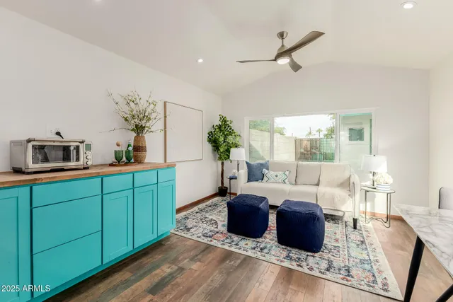 a living room with furniture and a large window