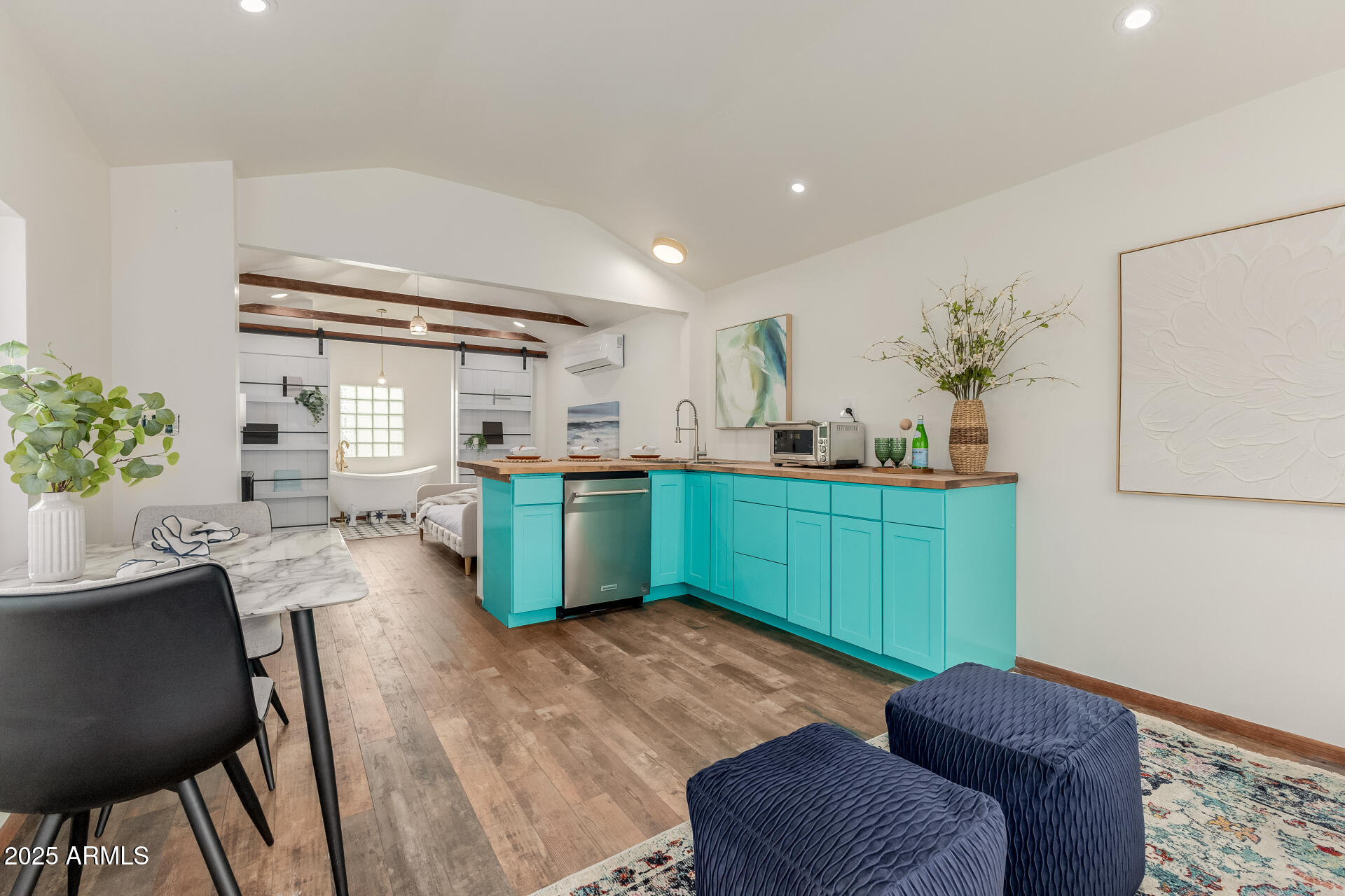 1305 East Granada Road Phoenix, AZ 85006 - Photo 21 of 35 a kitchen with cabinets table and chairs