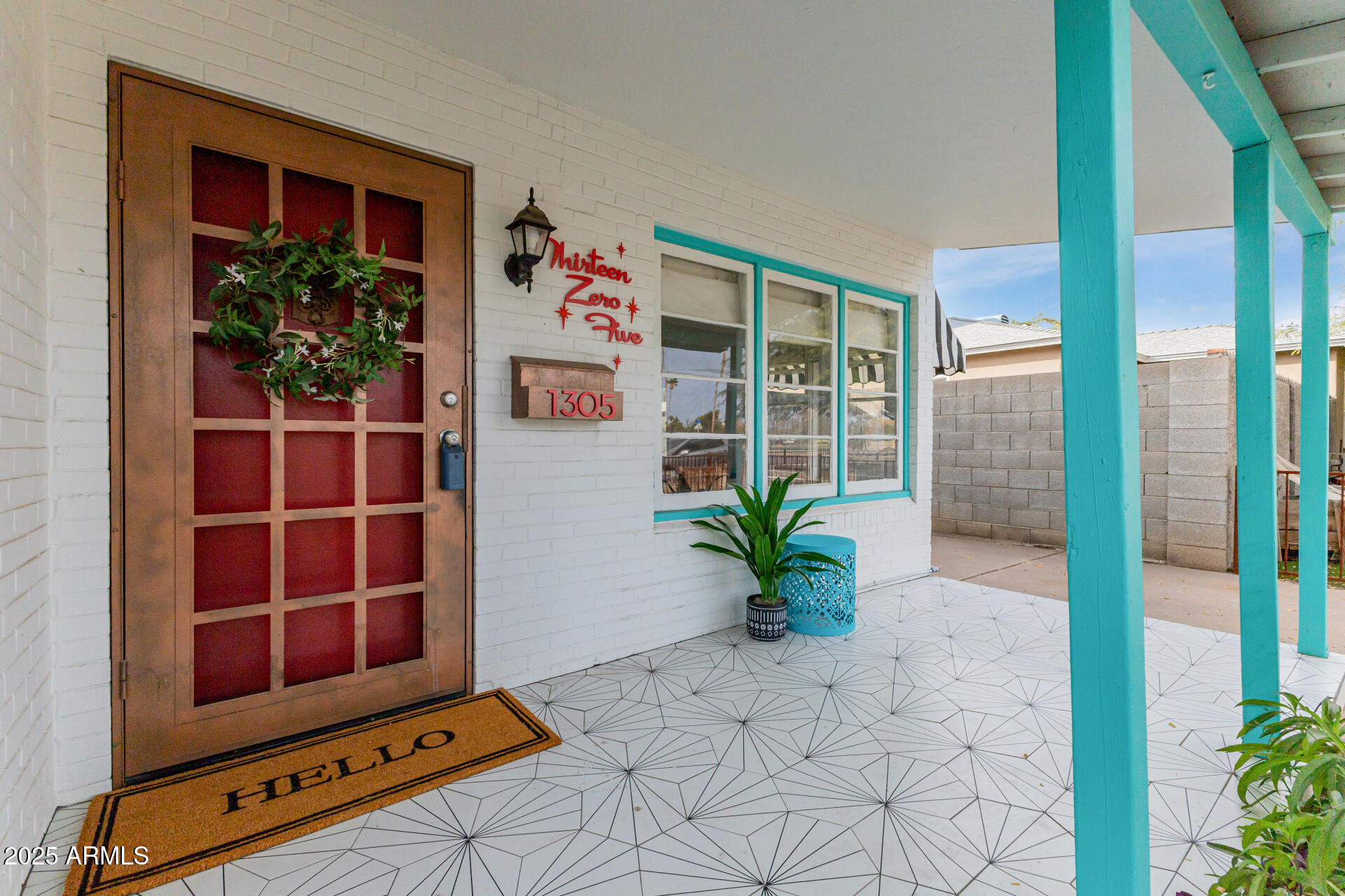 1305 East Granada Road Phoenix, AZ 85006 - Photo 3 of 35 a living room with a flat screen tv and a potted plant