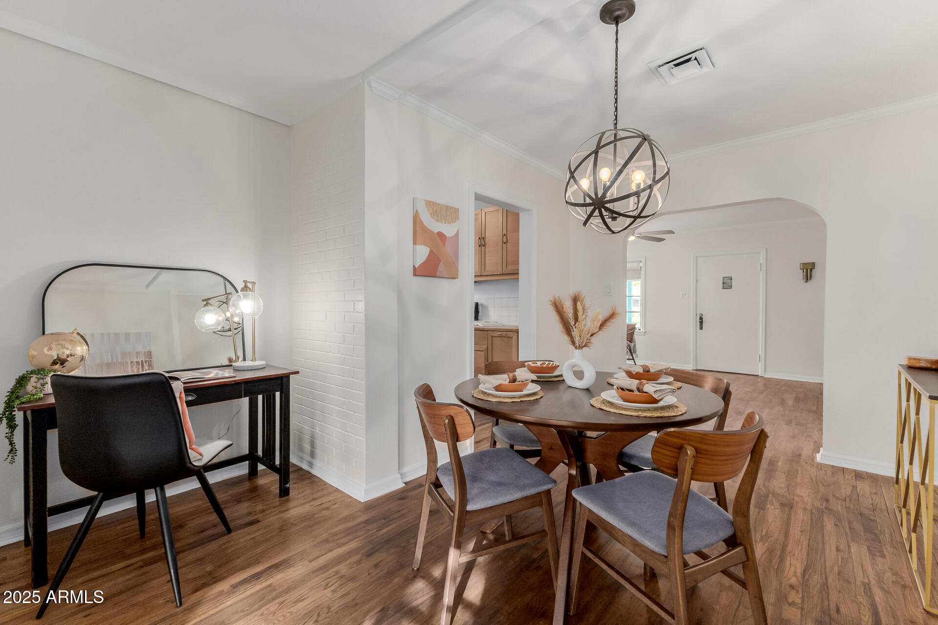 1305 East Granada Road Phoenix, AZ 85006 - Photo 9 of 35 a view of a dining room with furniture a chandelier and wooden floor