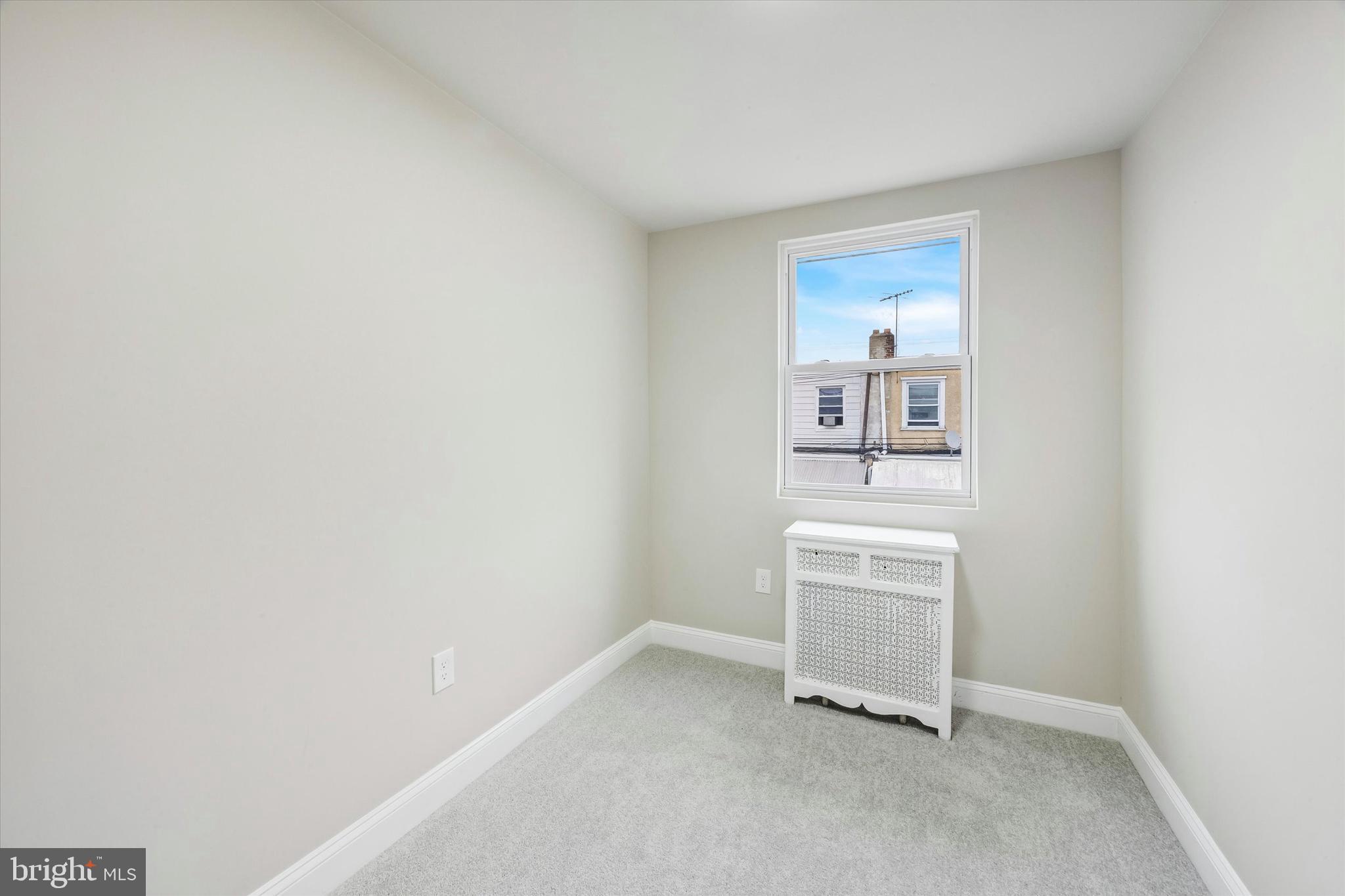 519 Littlecroft Road Upper Darby, PA 19082 - Photo 11 of 12 a view of a kitchen with white cabinets and dishwasher