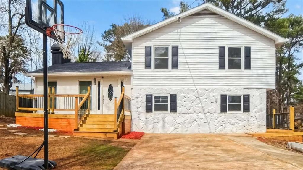 3221 Bromley Rowe Duluth, GA 30096 - Photo 1 of 44 a view of a white house with large windows