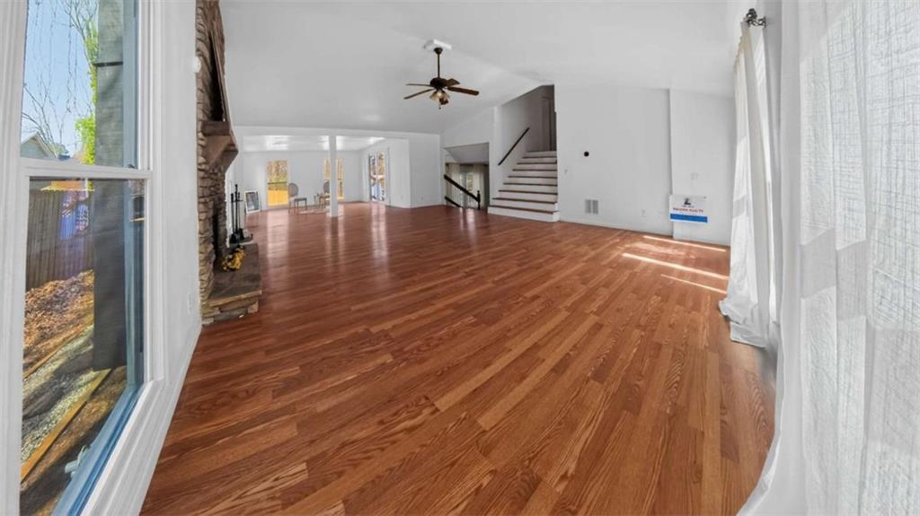 3221 Bromley Rowe Duluth, GA 30096 - Photo 11 of 44 wooden floor in an empty room with a window