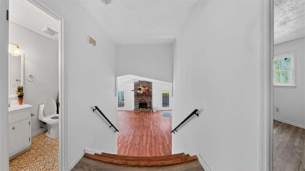 3221 Bromley Rowe Duluth, GA 30096 - Photo 12 of 44 a view of entryway and hall with wooden floor
