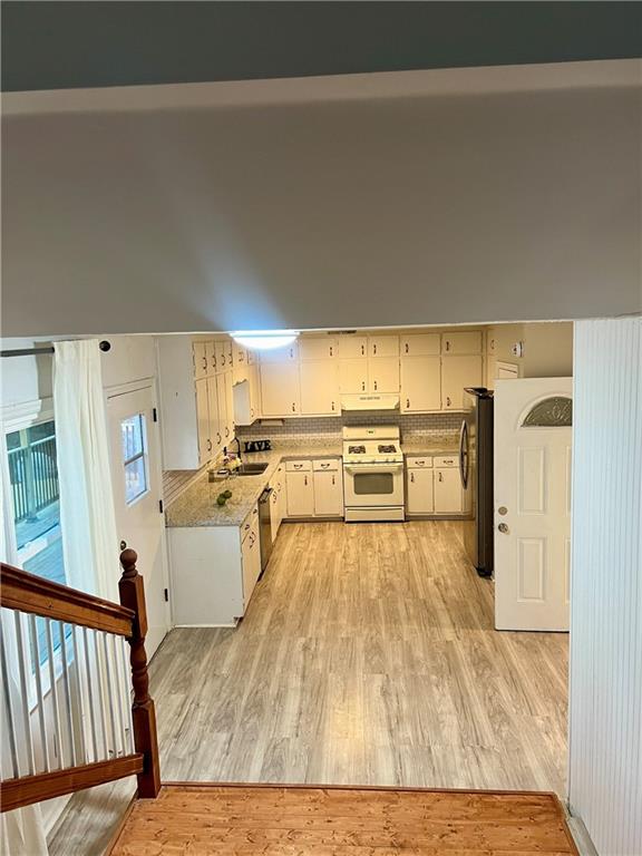 3221 Bromley Rowe Duluth, GA 30096 - Photo 18 of 44 a view of a living room and kitchen area