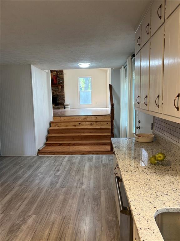 3221 Bromley Rowe Duluth, GA 30096 - Photo 20 of 44 a view of a kitchen with granite countertop a sink and a stove