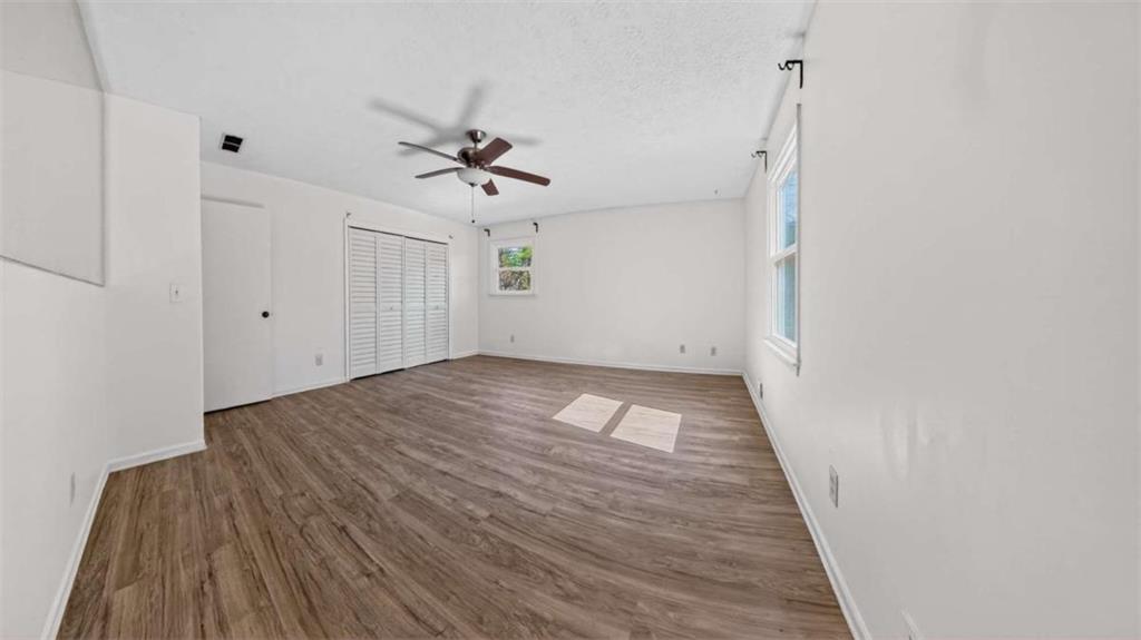 3221 Bromley Rowe Duluth, GA 30096 - Photo 22 of 44 a view of empty room with wooden floor