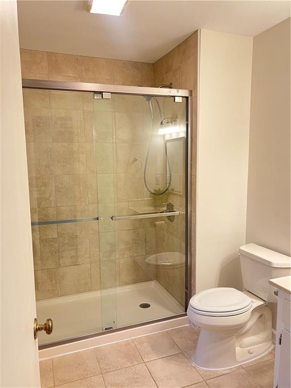 3221 Bromley Rowe Duluth, GA 30096 - Photo 23 of 44 a bathroom with a shower a toilet and a sink