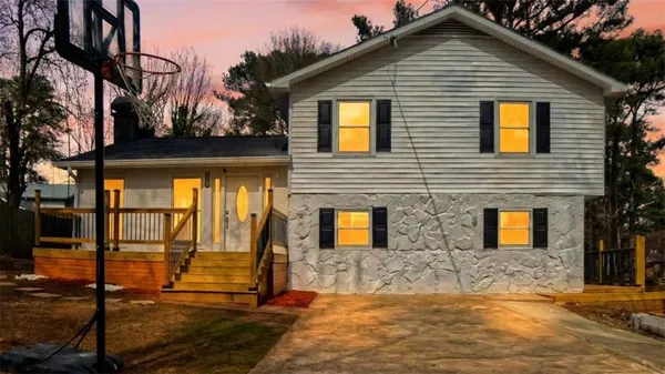 a front view of a house with a yard