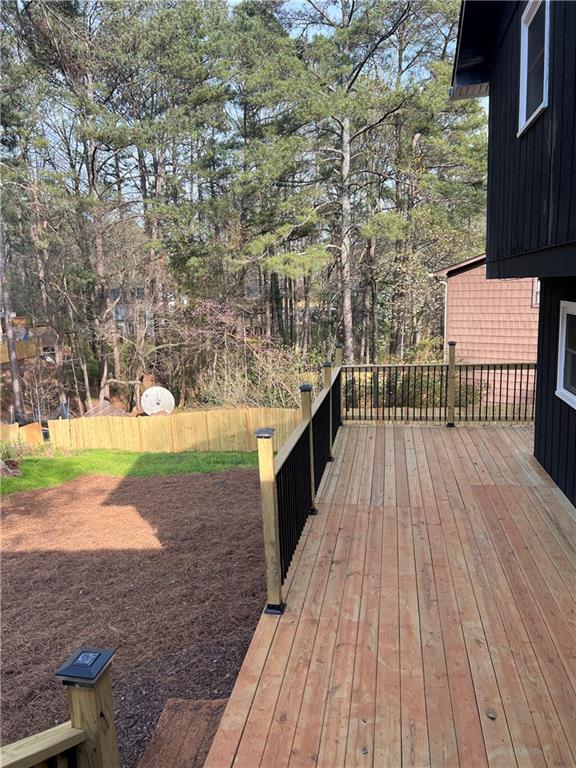 3221 Bromley Rowe Duluth, GA 30096 - Photo 35 of 44 a view of a backyard with wooden floor