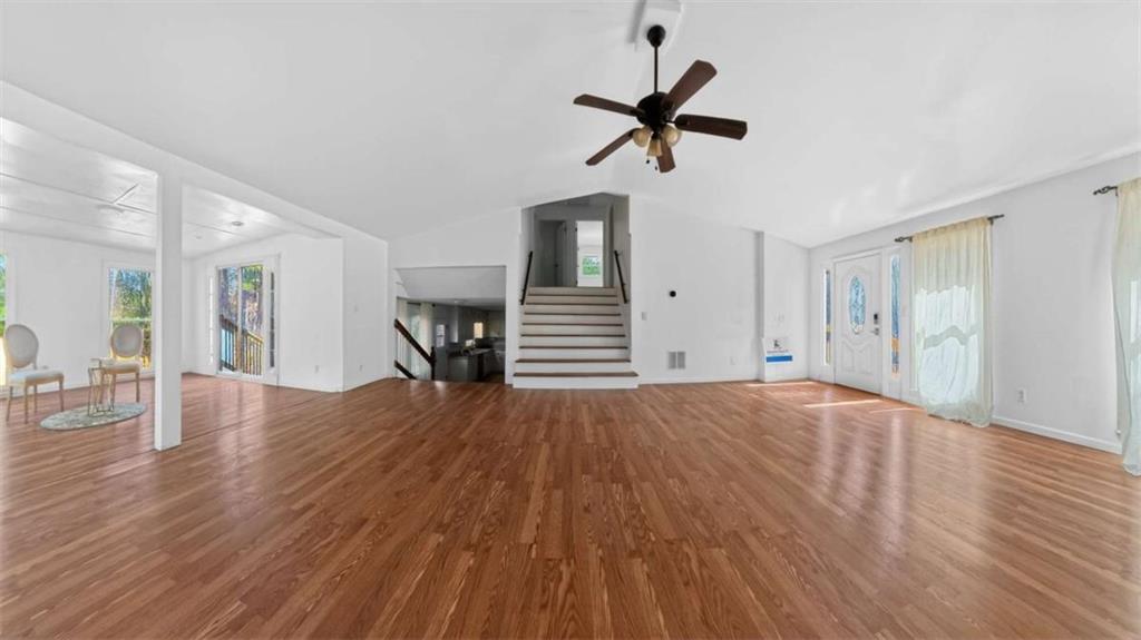 3221 Bromley Rowe Duluth, GA 30096 - Photo 10 of 44 a view of empty room with wooden floor and ceiling fan