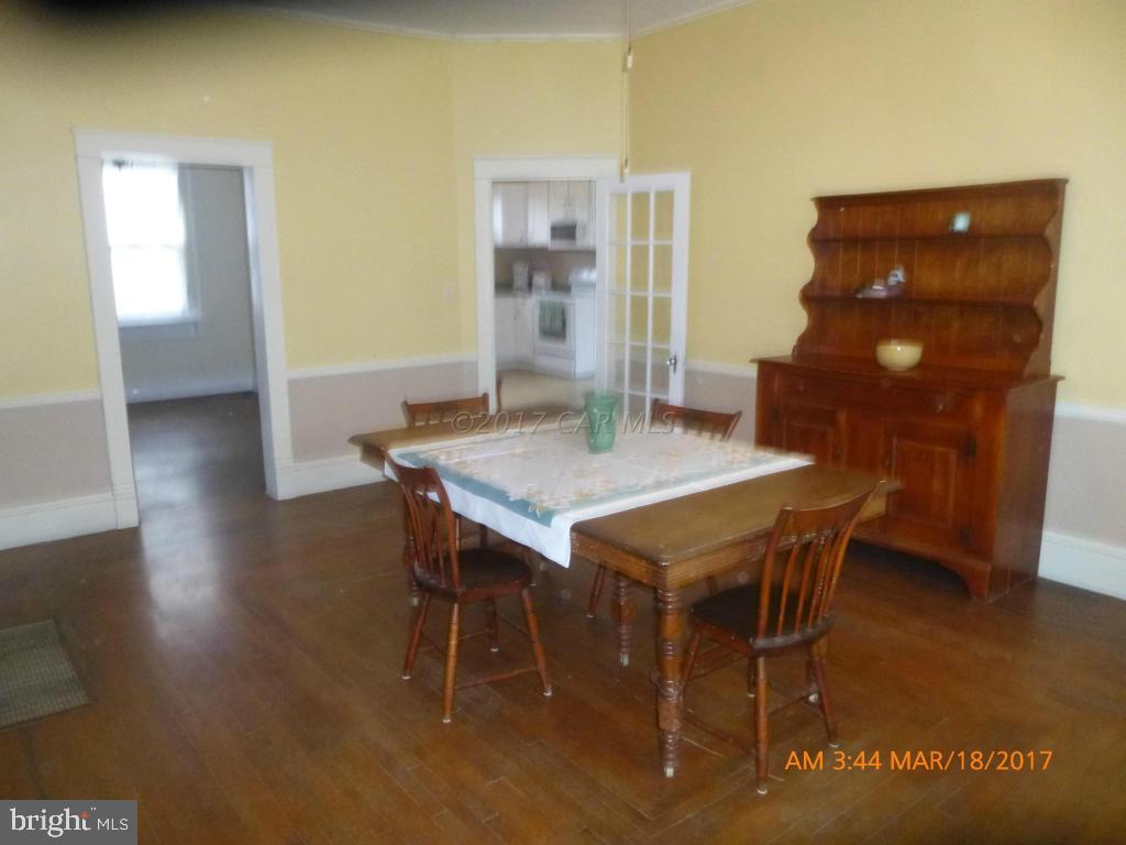 23468 Deal Island Road Deal Island, MD 21821 - Photo 2 of 20 a dining room with furniture and wooden floor