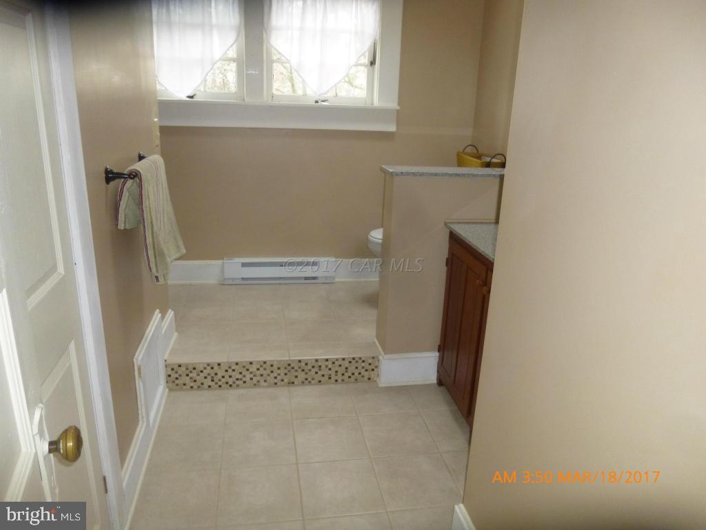 23468 Deal Island Road Deal Island, MD 21821 - Photo 12 of 20 a bathroom with a bathtub