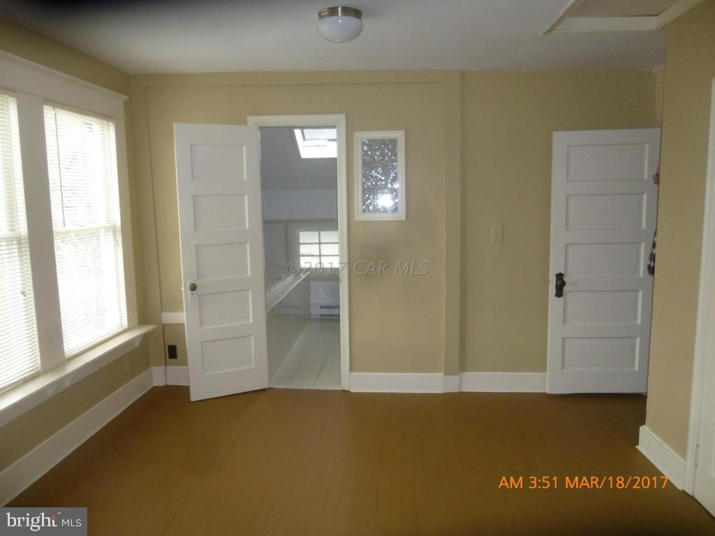 23468 Deal Island Road Deal Island, MD 21821 - Photo 16 of 20 an empty room with windows