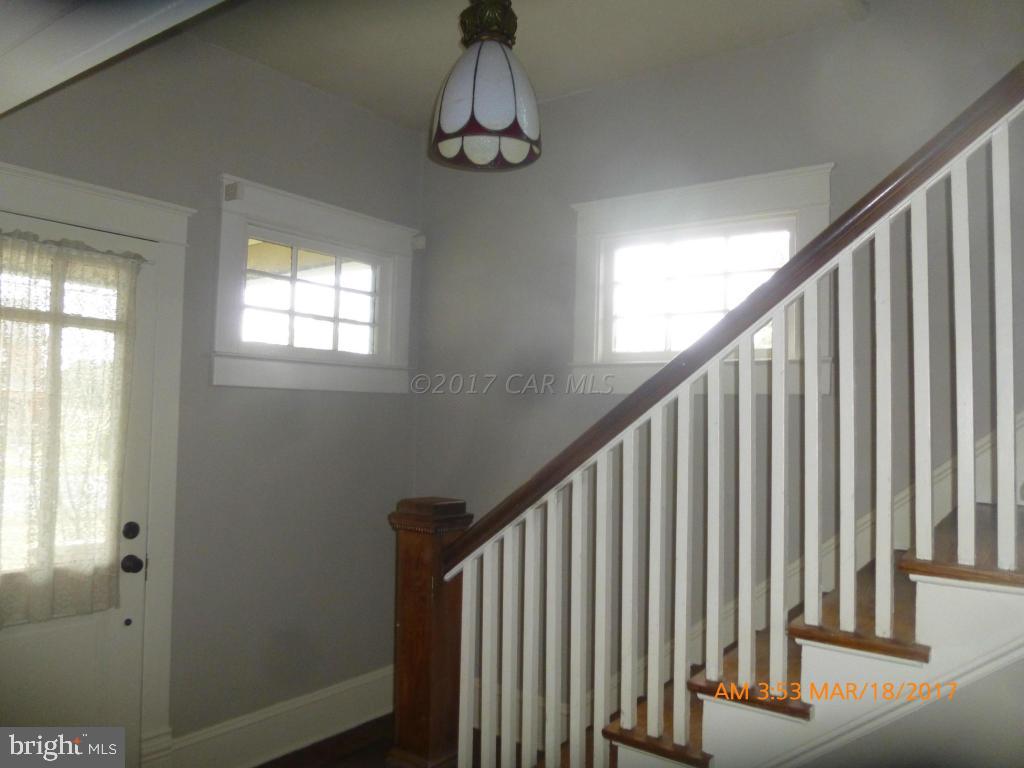 23468 Deal Island Road Deal Island, MD 21821 - Photo 18 of 20 a view of staircase with wooden floor and stairs