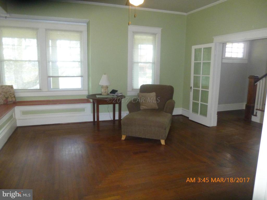 23468 Deal Island Road Deal Island, MD 21821 - Photo 4 of 20 a living room with furniture and a window