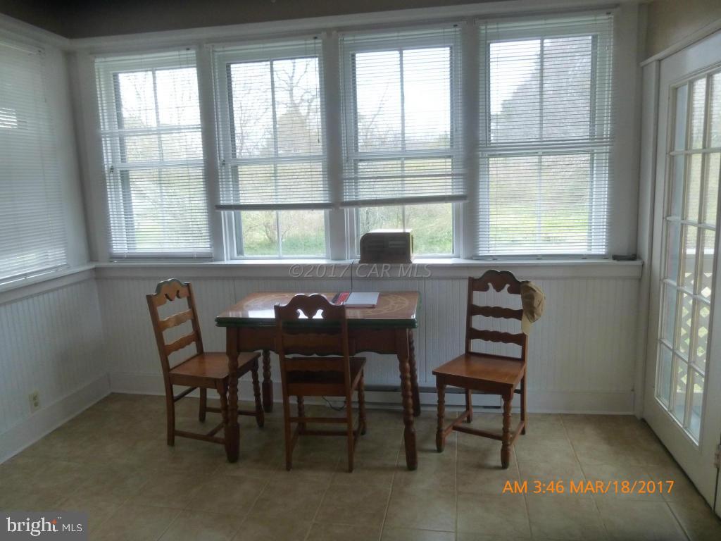 23468 Deal Island Road Deal Island, MD 21821 - Photo 6 of 20 a view of a dining room with furniture and a window