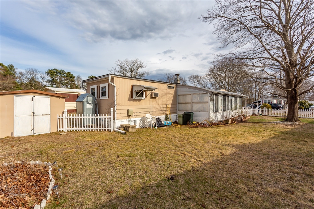 20 Madeline Street Wareham, MA 02538 - Photo 20 of 22 a view of a house with a yard covered in snow