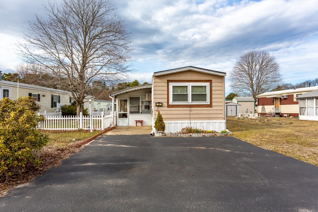 20 Madeline Street Wareham, MA 02538 - Photo 4 of 22 a front view of a house with a yard