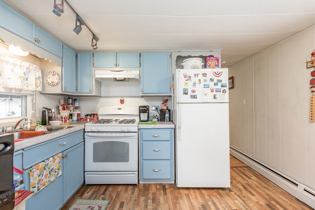 20 Madeline Street Wareham, MA 02538 - Photo 6 of 22 a kitchen with a white stove top oven and refrigerator