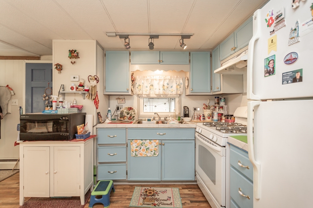 20 Madeline Street Wareham, MA 02538 - Photo 7 of 22 a kitchen with stainless steel appliances a stove a sink and a refrigerator