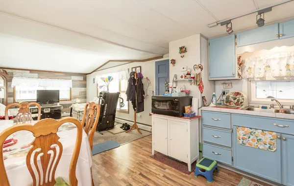 a view of a kitchen and dining room
