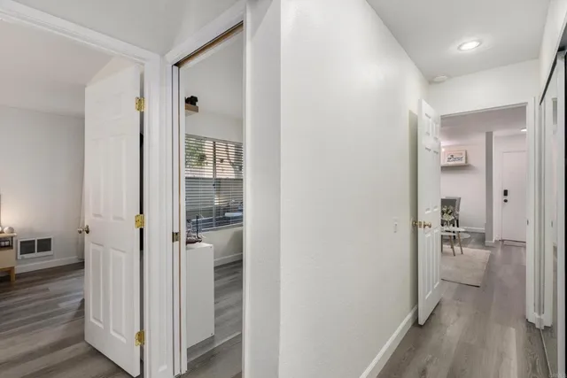 a view of a bathroom from a hallway